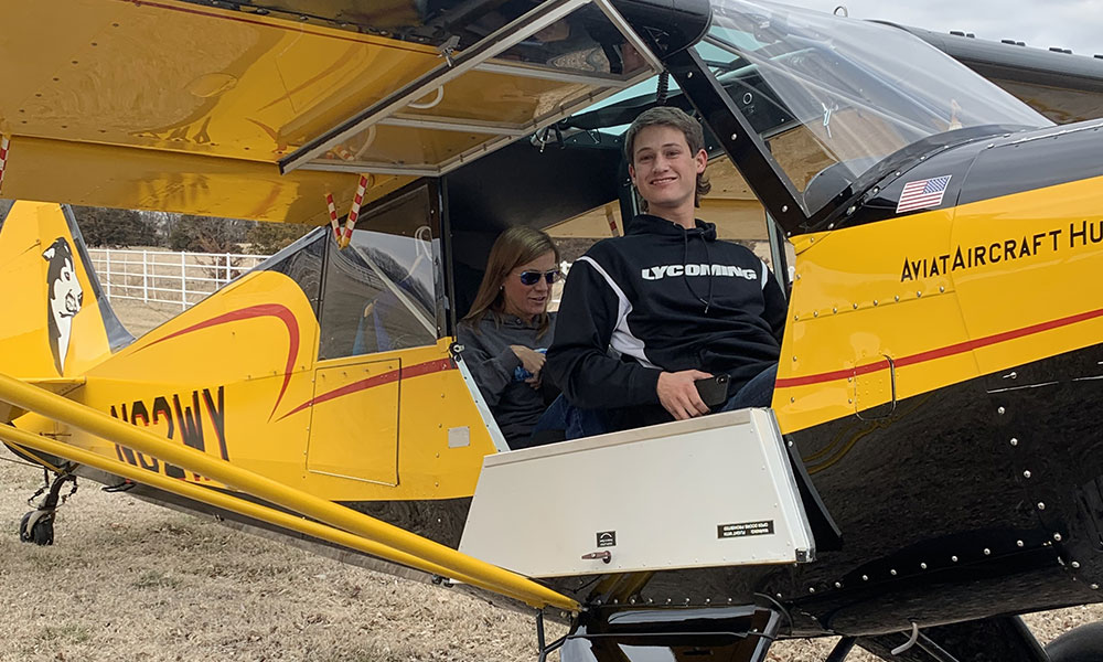 Austin Clemens flying his Mom, Julie, around